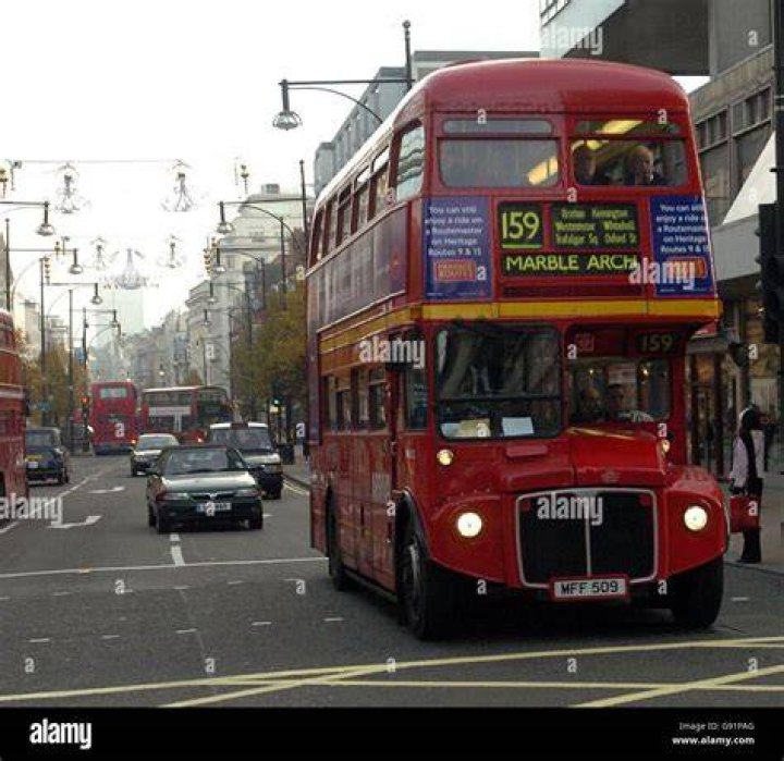 A bus makes its way through flooded roads in London's Greenwich last night