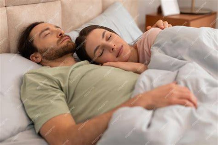 A Couple Sleeping in the spoon Position