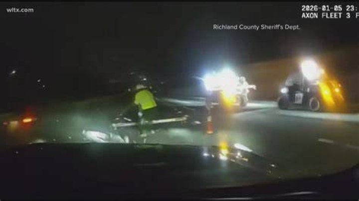 A deputy on site sprinted to help the driver, who survived the collision