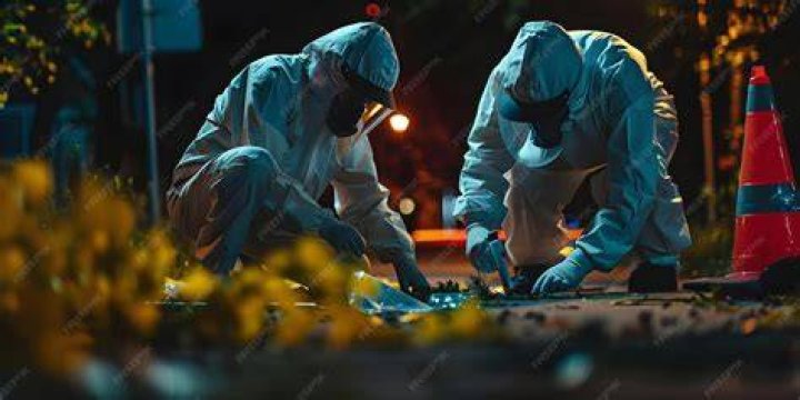  A forensic officer working at the scene after the tragedy