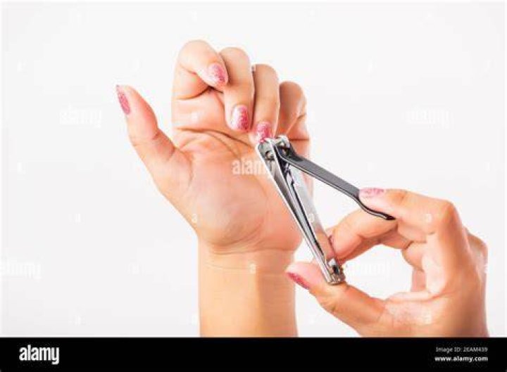 A woman with nails using one of the Best essie Nail Polish Colors to Add to Your Collection