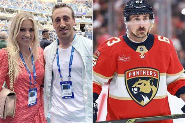 Brad Marchand and his wife Katrina at a stadium 