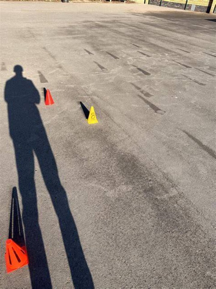 Cones have been used to section off space for a bus outside Knockhall Primary School -but some say it's worsening existing problems at busy times