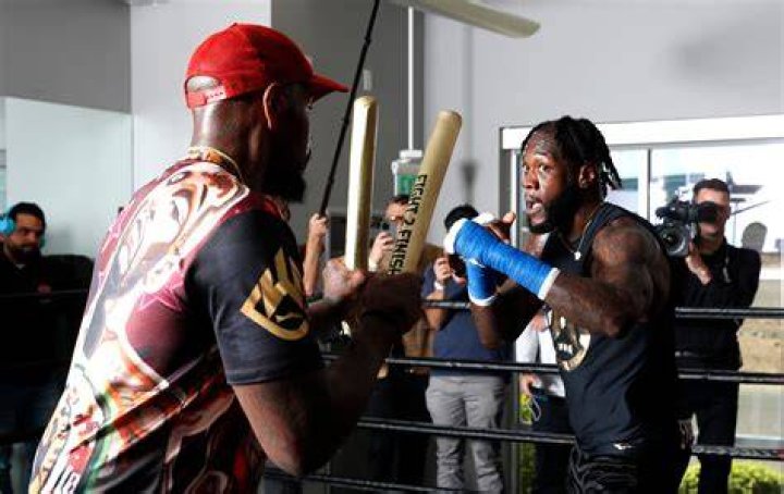 Deontay Wilder, pictured with his training camp, has never looked more focused before a big fight, according to Cosmo and Donato