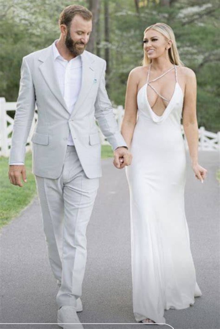 Dustin Johnson and Paulina Gretzky walk hand in hand after his Masters triumph