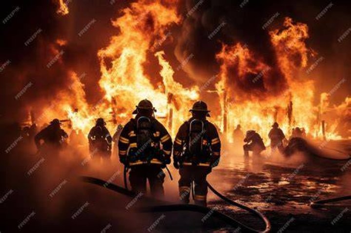 Firefighters battling the huge fire at the paper mill in Oldham evacuated 100 people