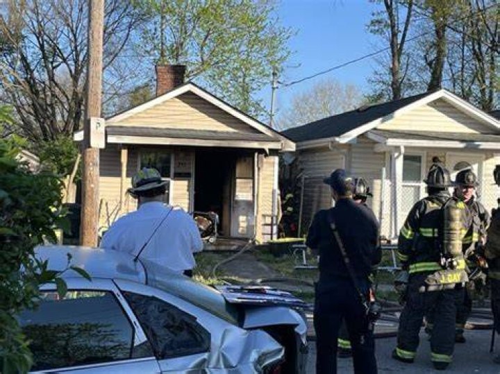 Firefighters charged into the home wearing breathing apparatus to find a further five people on the first floor of the building