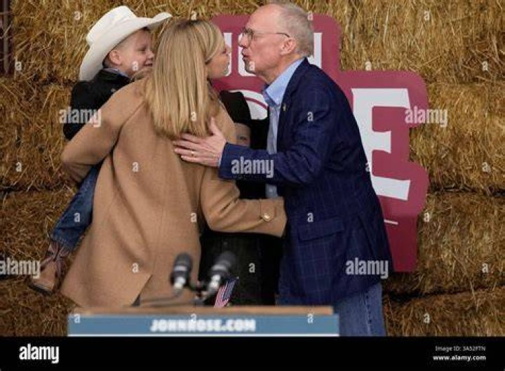 George kisses his wife Elizabeth