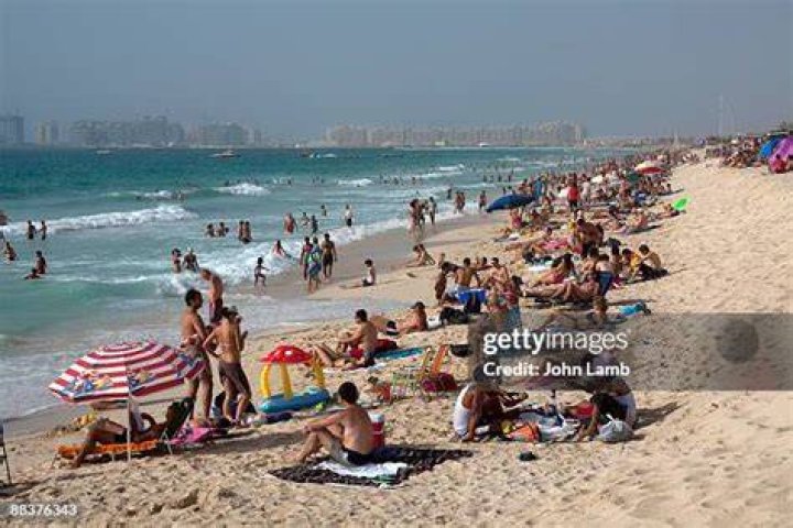 Holidaymakers on the beach in Weymouth on Saturday