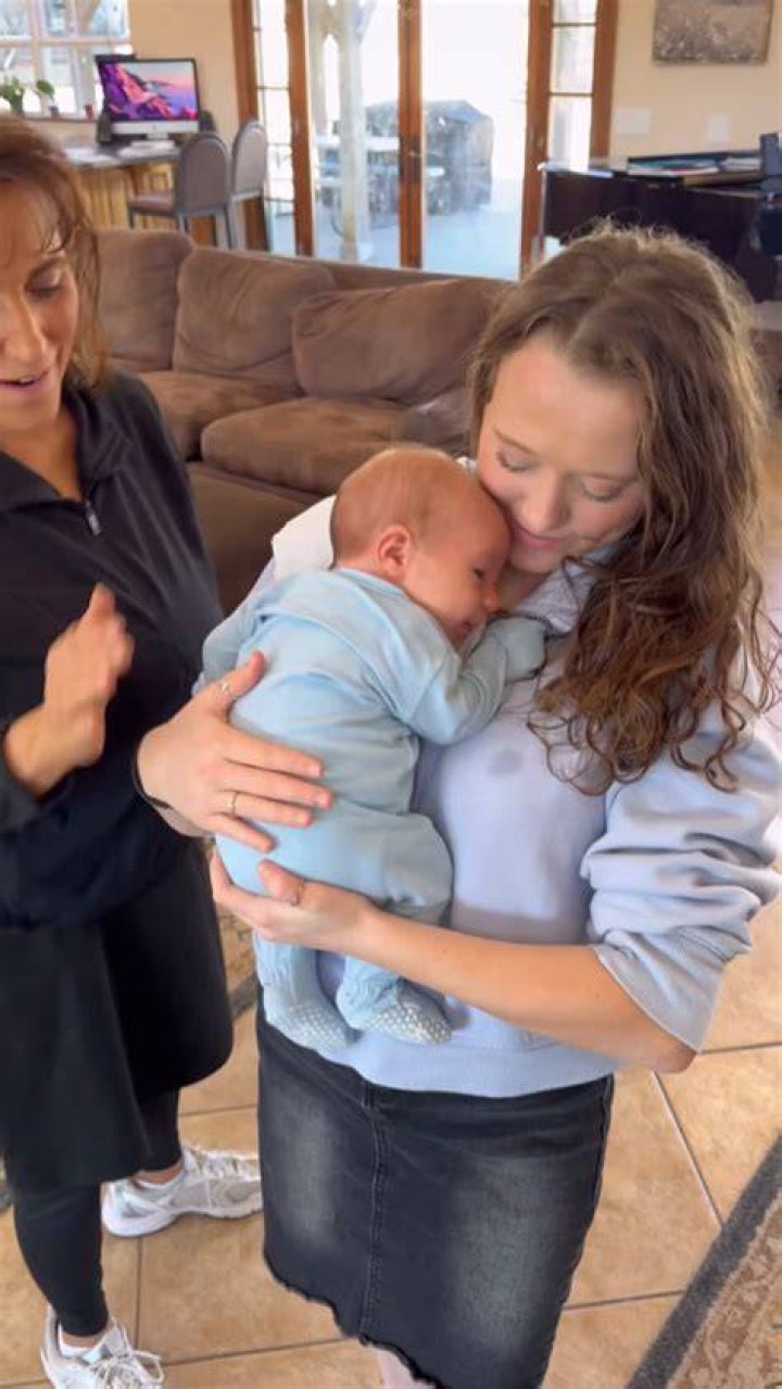 Jana Duggar holding Layla while visiting Carlin Bates.