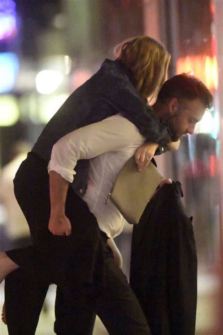  Jennifer Lawrence receives a piggyback from her boyfriend Cooke Maroney