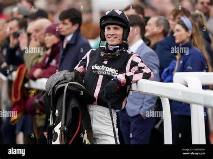  Jockey Harry Cobden jumps clear from the horse