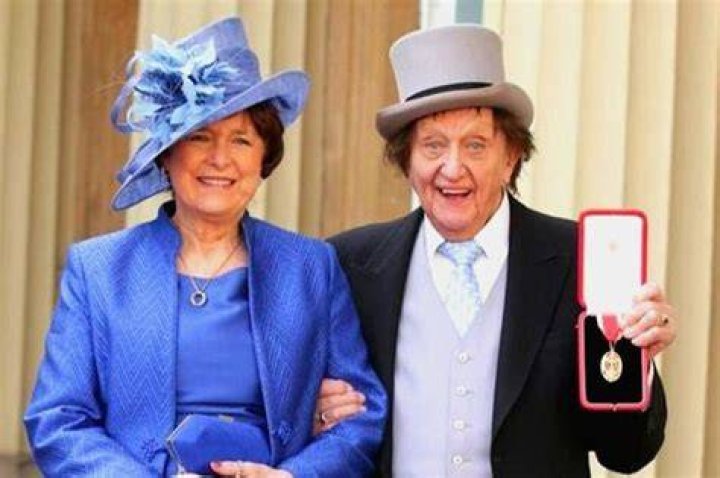 Ken Dodd receiving a knighthood in 2017 with fiancée Anne