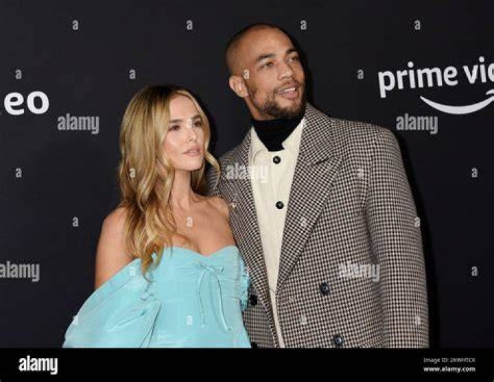 Kendrick Sampson and Zoey Deutch standing on a busy sidewalk in the Prime Video move, Something From Tiffany's