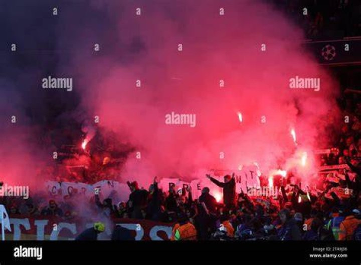 Lens fans lit flares inside the Emirates