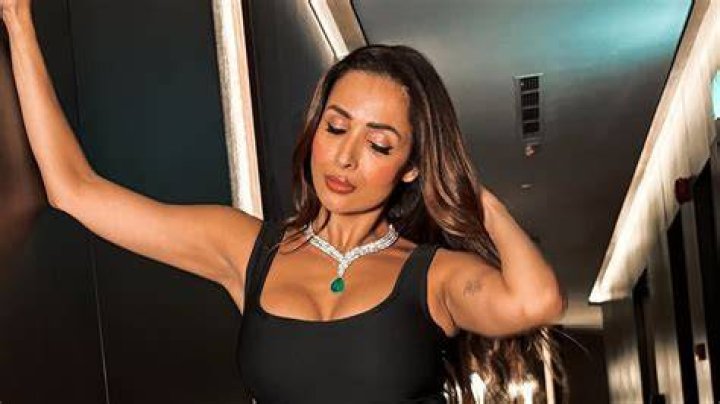 Malaika Arora&rsquo;s monochromatic moment in black bodysuit and flared pants has us picking our jaws up off the floor (PC: Viral Bhayani)