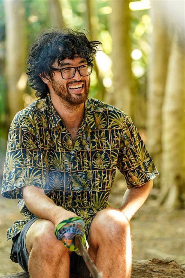 Matt Blankinship Survivor 44 looks serious against a gold background with glasses