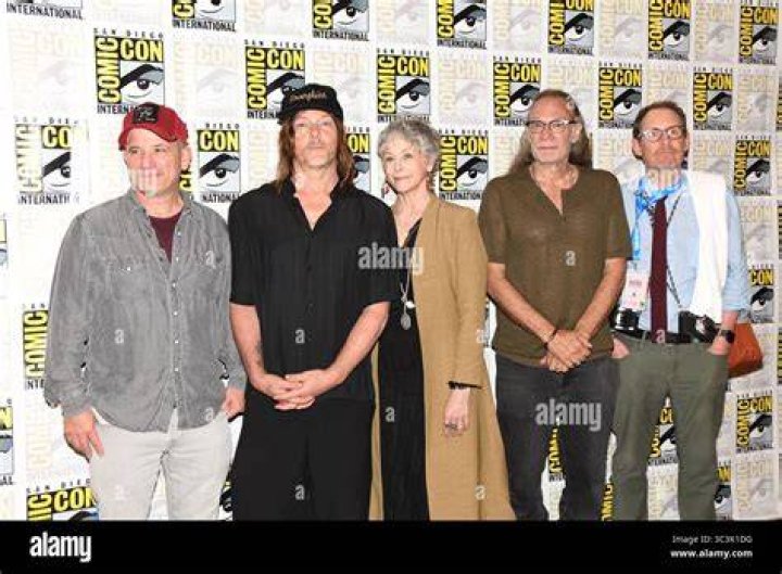 Melissa McBride, Greg Nicotero, and Norman Reedus, shown on set for Episode 24 of AMC's The Walking Dead Season 11
