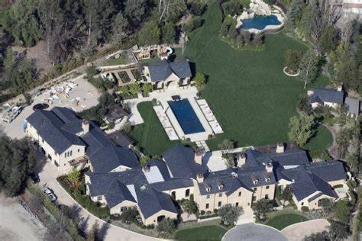 Outside of her home, Kim's trees are covered in white lights