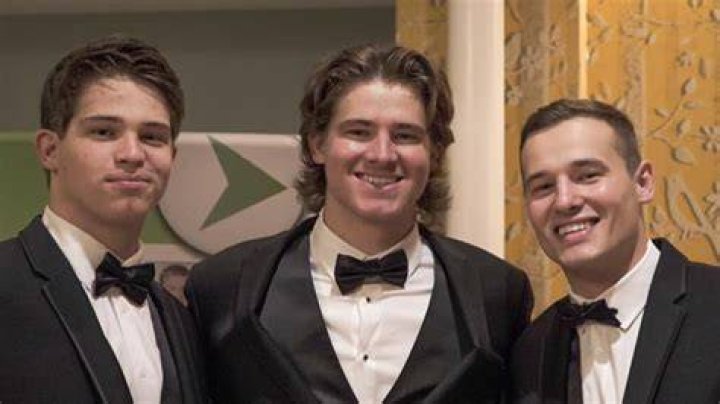 Patrick, Justin, and Mitchell Herbert Play with Ducks At Their Family Home