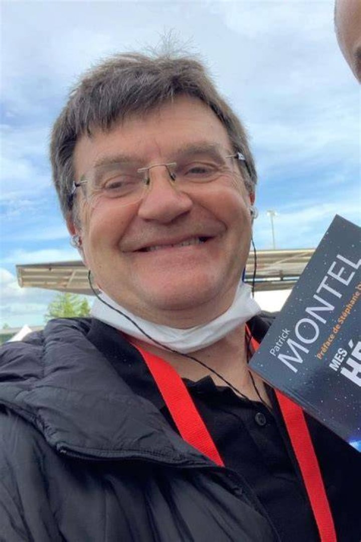 Patrick Montel Taking A Picture With His Book