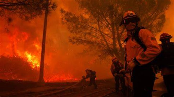 People watch on as fires approach homes and hotels in Marmaris