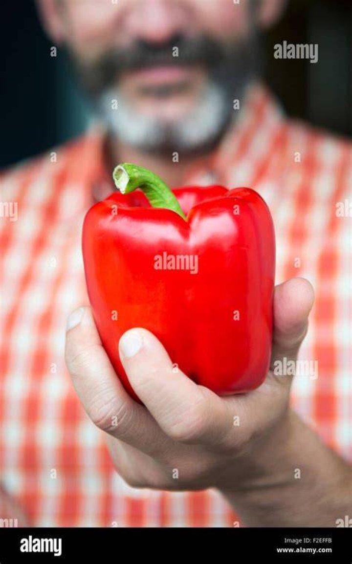  Pictured a man holding pepper spray