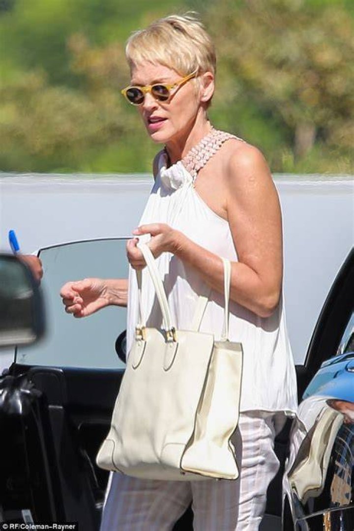 Sharon wore a white ensemble for the evening show