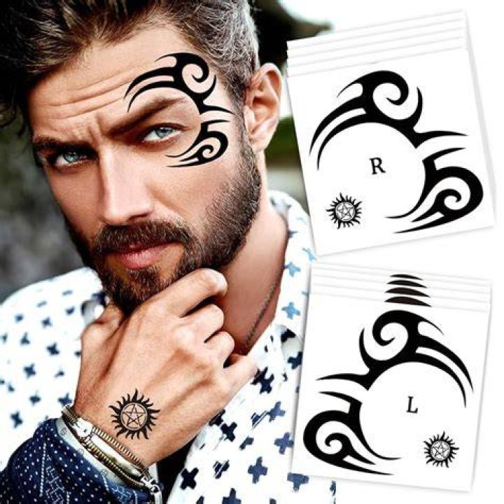Simple Tribal Face Tattoo smile.inked