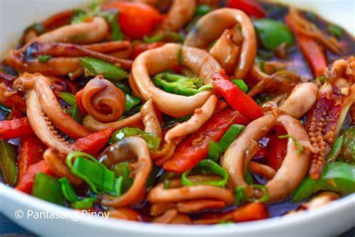 Stir-fried squid with red chilli and spring onions