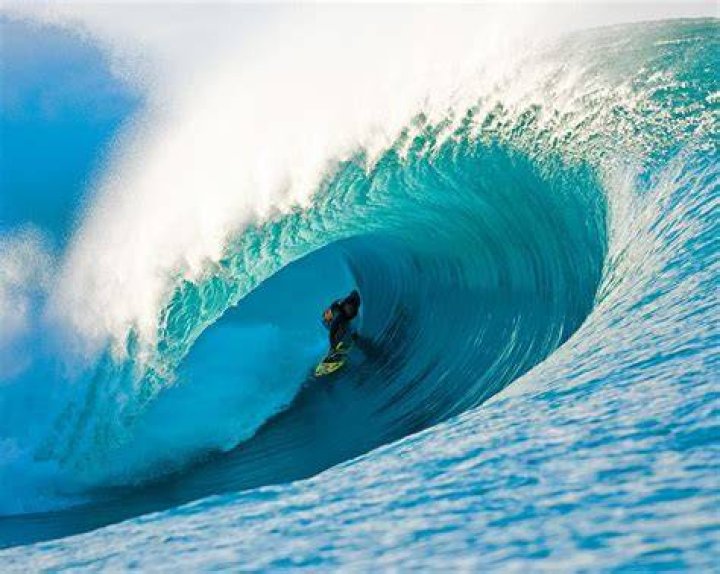 Surfer Surfing In The Big Waves