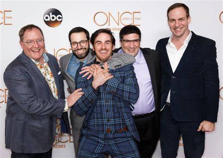 The cast celebrating their mini-game win.
