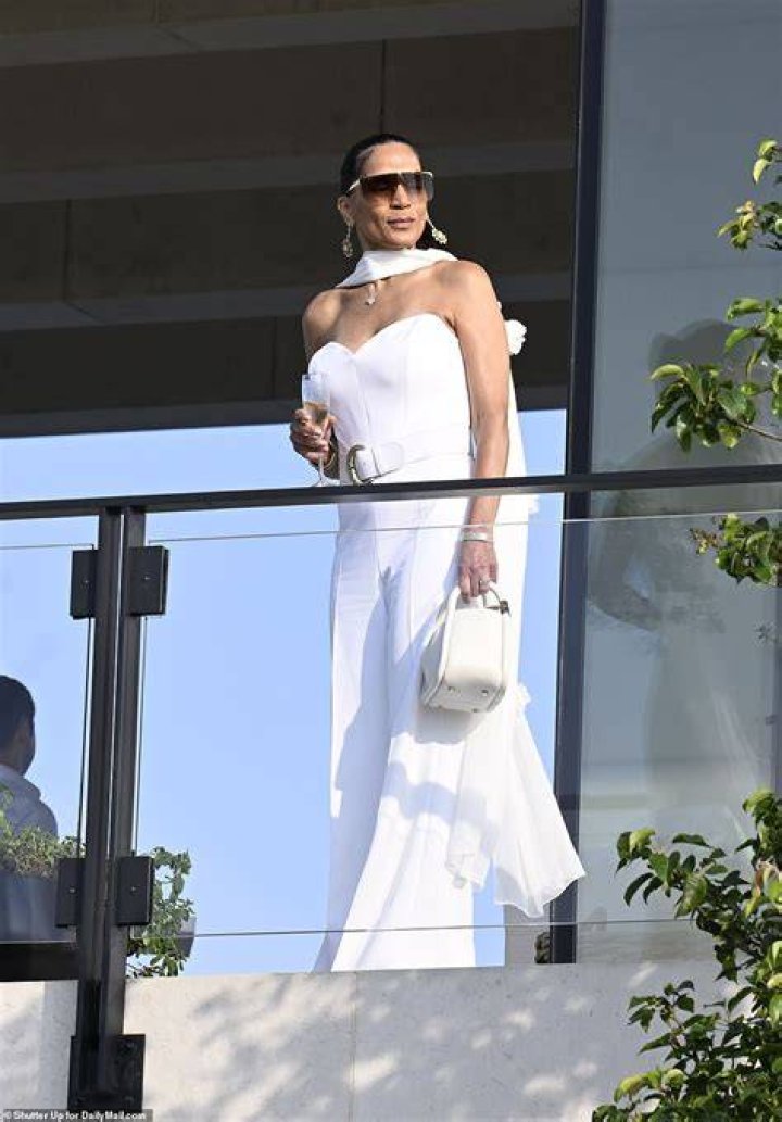  The model sipped champagne as she glammed up