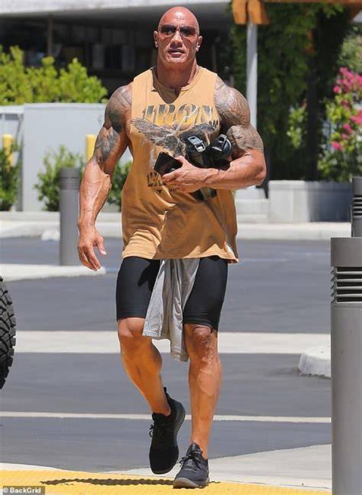  The Rock showed off his muscles and his golf swing while filming for his TV show