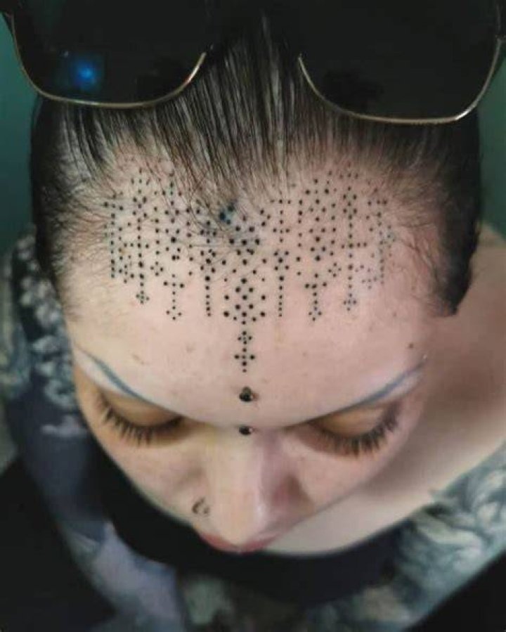 Tribal Face Forehead Tattoo goldleaftattoocollective