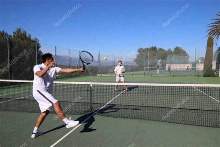 Two Tennis Players Competing Against Each Other In The Olympics