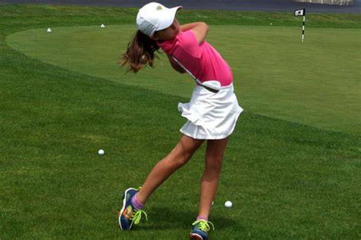 Young Gabby Golf Girl With Her Parents